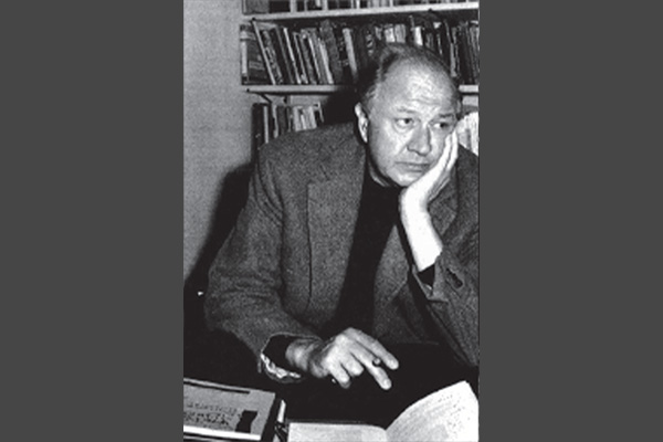 Theodore Roethke sitting at his desk
